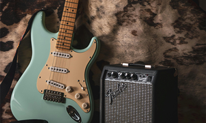 Electric Guitar and Amp with Red Cowboy Hat