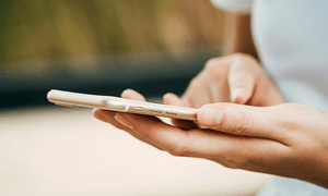 Person Standing While Using Phone
