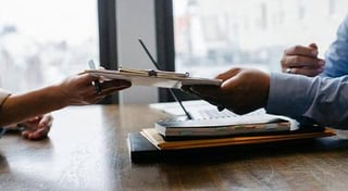 People sharing a document